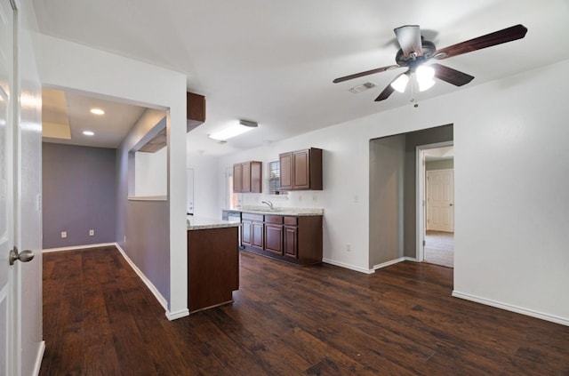 6650 Pine Mill Rd, Reno, TX 75462 - kitchen featuring a sink, ceiling fan, dark wood-style floors, baseboards, and recessed lighting