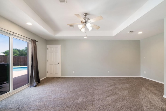 6650 Pine Mill Rd, Reno, TX 75462 - empty room with a raised ceiling, carpet, a ceiling fan, baseboards, and recessed lighting