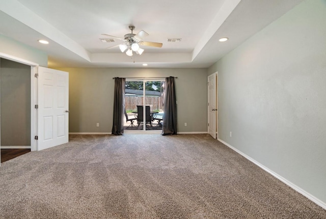 6650 Pine Mill Rd, Reno, TX 75462 - carpeted spare room featuring a ceiling fan, a raised ceiling, baseboards, and recessed lighting