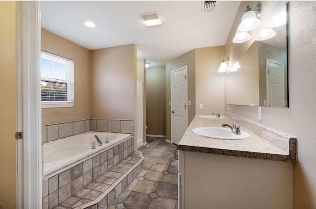 6650 Pine Mill Rd, Reno, TX 75462 - bathroom featuring a bath, double vanity, and tile patterned flooring