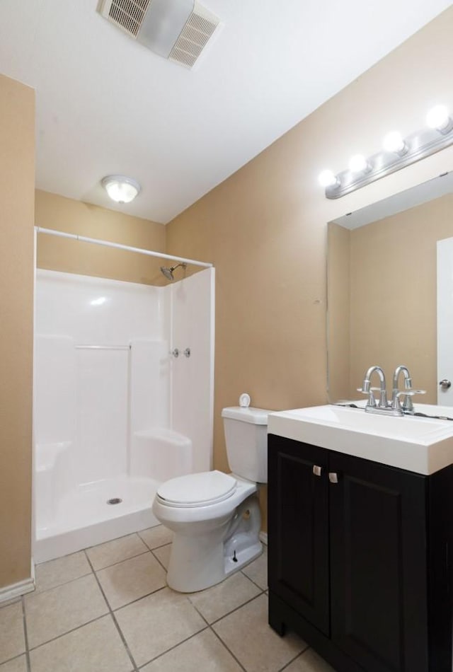 6650 Pine Mill Rd, Reno, TX 75462 - bathroom with toilet, vanity, tile patterned floors, and a shower