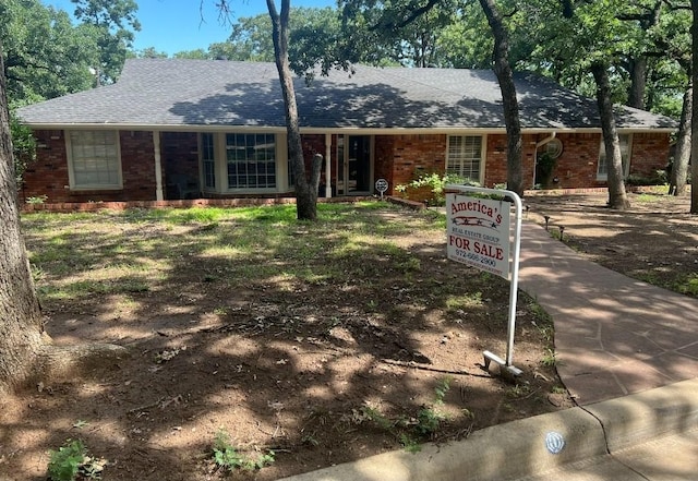 5805 Azteca Dr, Fort Worth, TX 76112 - ranch-style house with brick siding and roof with shingles