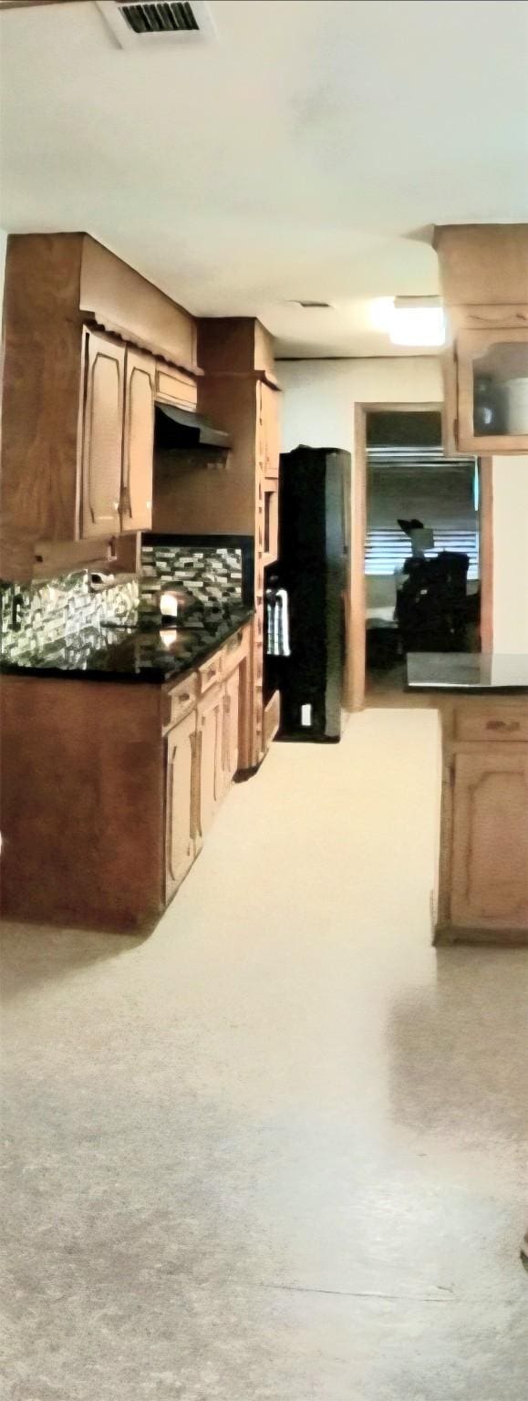 5805 Azteca Dr, Fort Worth, TX 76112 - kitchen featuring backsplash, dark countertops, and under cabinet range hood