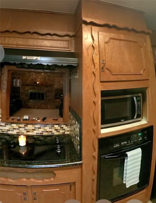 5805 Azteca Dr, Fort Worth, TX 76112 - kitchen featuring black appliances, decorative backsplash, and dark countertops