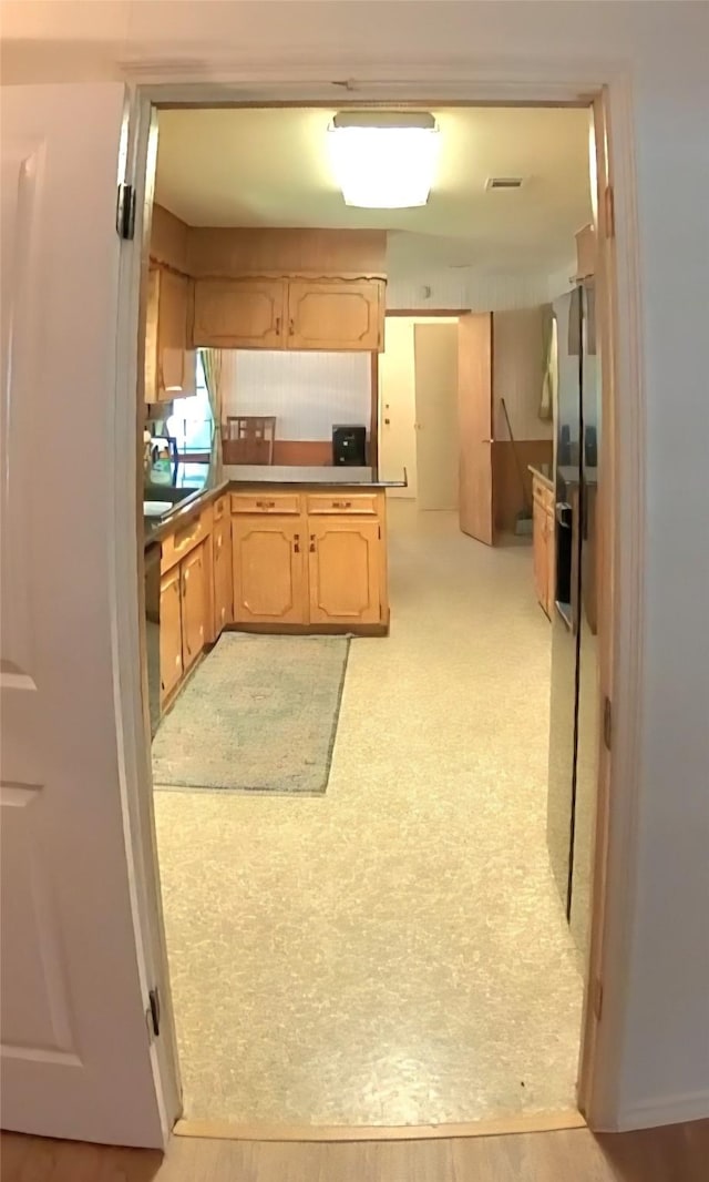 5805 Azteca Dr, Fort Worth, TX 76112 - kitchen featuring light brown cabinets and a peninsula