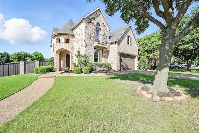 49 Pristine Pond Dr, Frisco, TX 75034 - french country inspired facade with stone siding, a garage, driveway, and brick siding