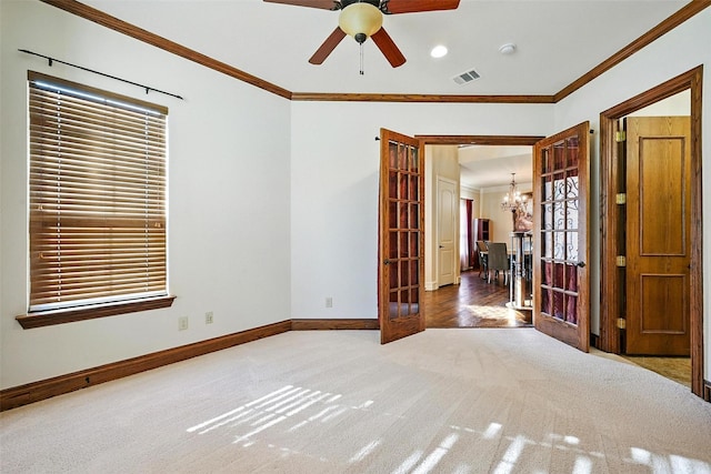 49 Pristine Pond Dr, Frisco, TX 75034 - carpeted spare room featuring a chandelier, crown molding, a ceiling fan, french doors, and healthy amount of natural light