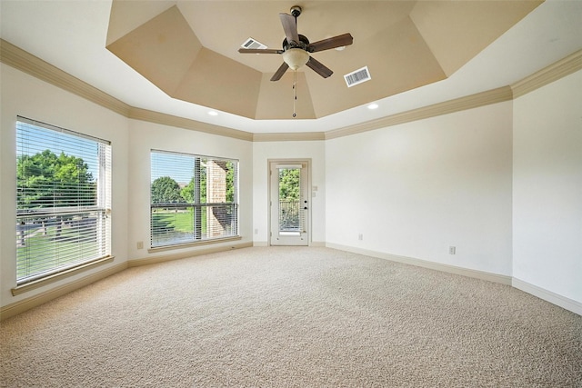 49 Pristine Pond Dr, Frisco, TX 75034 - spare room featuring a raised ceiling, crown molding, light colored carpet, plenty of natural light, and ceiling fan