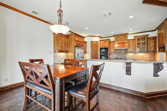 49 Pristine Pond Dr, Frisco, TX 75034 - kitchen with black appliances, ornamental molding, glass insert cabinets, brown cabinets, and recessed lighting