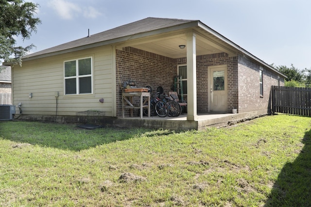 1204 Bluff View Dr, Hutchins, TX 75141 - rear view of house featuring central AC, brick siding, and a patio area