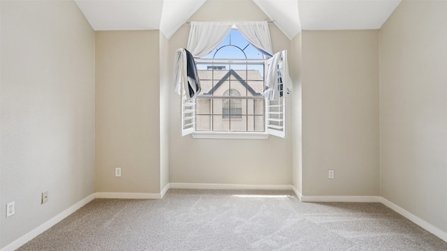 3901 Travis St Unit 230, Dallas, TX 75204 - carpeted empty room featuring baseboards and vaulted ceiling