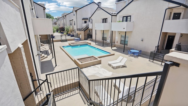 3901 Travis St Unit 230, Dallas, TX 75204 - community pool featuring a residential view, a jacuzzi, and a patio