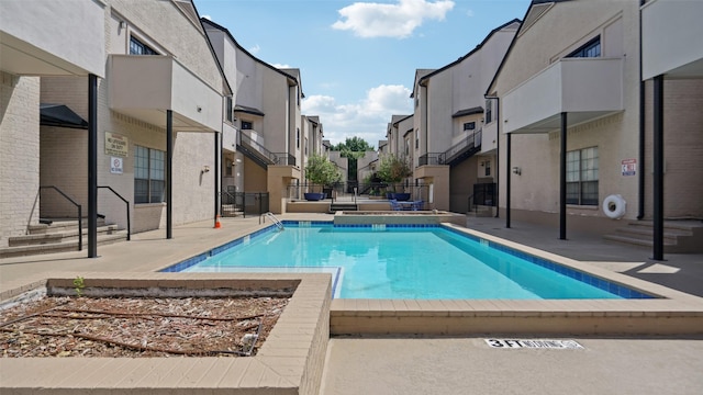 3901 Travis St Unit 230, Dallas, TX 75204 - community pool featuring a residential view