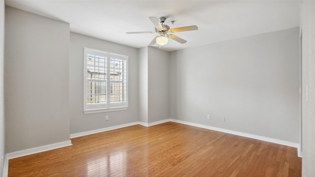 3901 Travis St Unit 230, Dallas, TX 75204 - empty room with wood finished floors, a ceiling fan, and baseboards