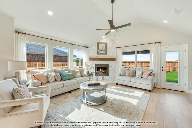 404 Atlas Cedar Dr, Glenn Heights, TX 75154 - living room with wood finished floors, ceiling fan, plenty of natural light, a high end fireplace, and recessed lighting