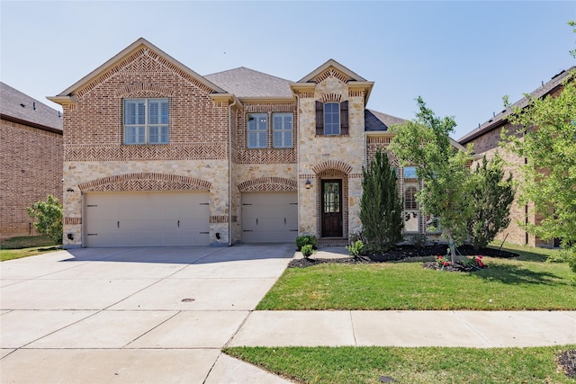 4300 Round Valley Ln, Fort Worth, TX 76262 - view of front of house featuring brick siding, an attached garage, a front lawn, driveway, and stone siding