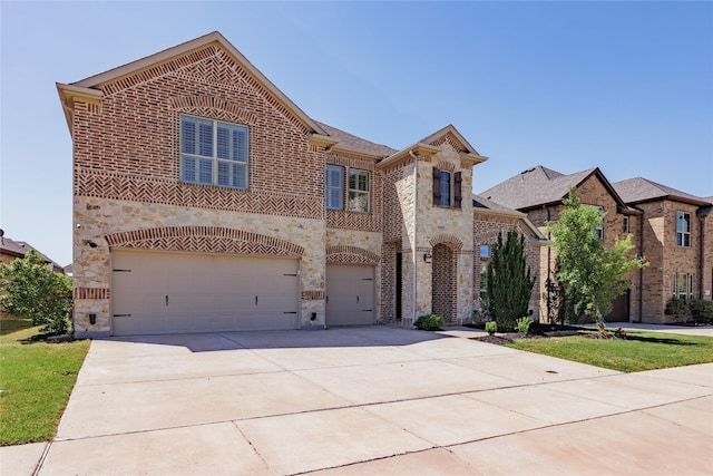 4300 Round Valley Ln, Fort Worth, TX 76262 - view of front of house with stone siding, a garage, brick siding, and driveway
