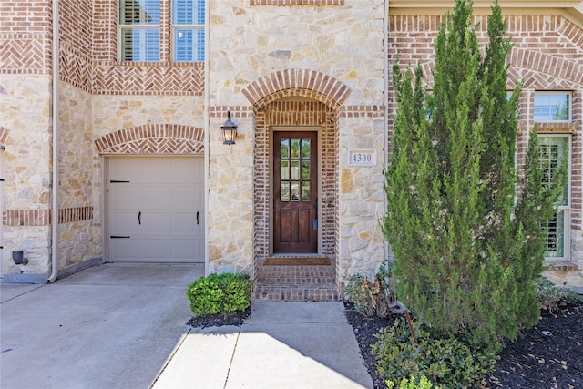 4300 Round Valley Ln, Fort Worth, TX 76262 - property entrance featuring concrete driveway, stone siding, and brick siding
