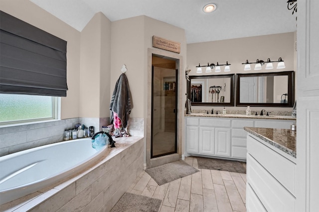 3006 Preston Club Dr, Sherman, TX 75092 - bathroom with double vanity, a bath, and a stall shower