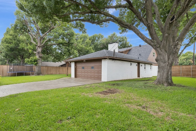 10328 Countess Dr, Dallas, TX 75229 - view of yard with an attached garage, driveway, and a trampoline