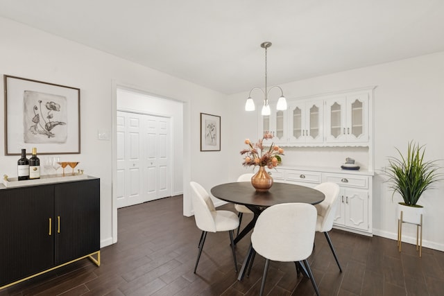 10328 Countess Dr, Dallas, TX 75229 - dining space featuring dark wood finished floors and baseboards