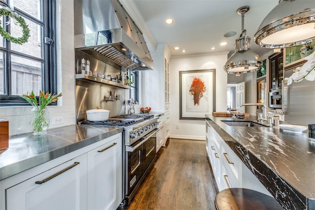 4205 Bryn Mawr Dr, University Park, TX 75225 - kitchen featuring stainless steel counters, range with two ovens, a sink, white cabinetry, and dark wood-style flooring