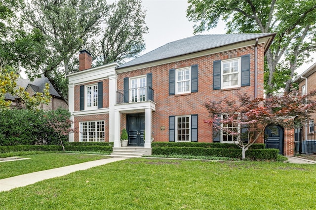 4205 Bryn Mawr Dr, University Park, TX 75225 - view of front facade with a balcony, brick siding, and french doors