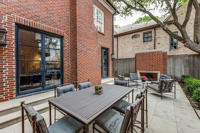 4205 Bryn Mawr Dr, University Park, TX 75225 - view of patio / terrace with a fireplace and french doors