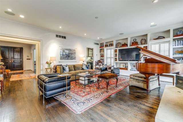 4205 Bryn Mawr Dr, University Park, TX 75225 - living area with dark wood finished floors, built in shelves, crown molding, and recessed lighting