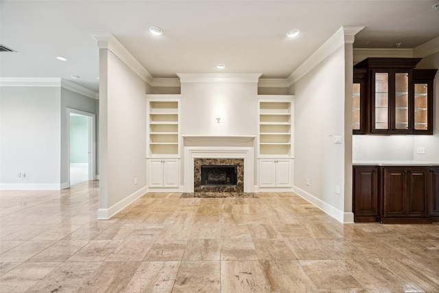 4240 Prescott Ave Unit 5B, Dallas, TX 75219 - unfurnished living room with baseboards, a premium fireplace, ornamental molding, recessed lighting, and built in features