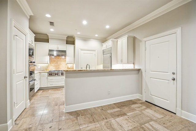 4240 Prescott Ave Unit 5B, Dallas, TX 75219 - kitchen with crown molding, under cabinet range hood, stainless steel appliances, a peninsula, and backsplash