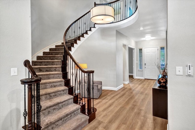 1516 Stonehill Ct, Allen, TX 75002 - foyer with baseboards, wood finished floors, and stairway