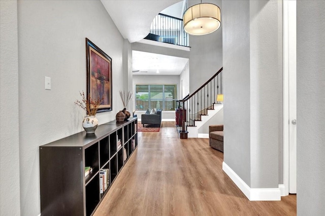 1516 Stonehill Ct, Allen, TX 75002 - foyer entrance featuring wood finished floors, stairs, and baseboards