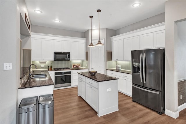 1516 Stonehill Ct, Allen, TX 75002 - kitchen featuring refrigerator with ice dispenser, oven, black microwave, a sink, and gas cooktop