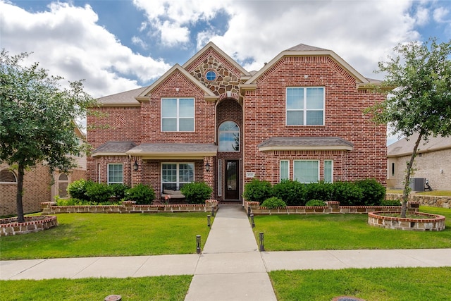 1518 E Oates Rd, Garland, TX 75043 - traditional-style home featuring brick siding and a front yard