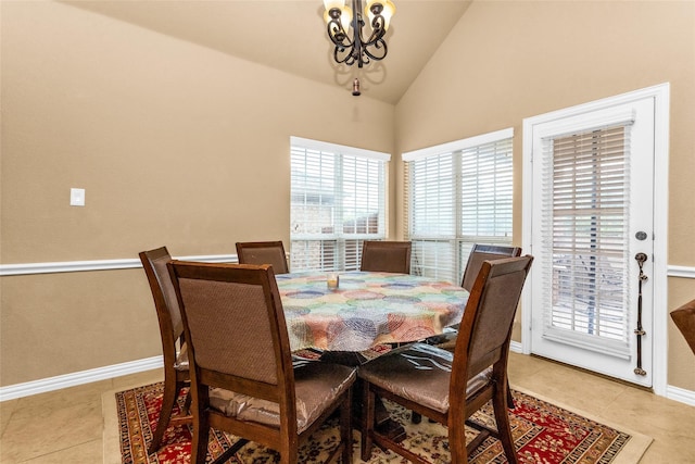 1518 E Oates Rd, Garland, TX 75043 - dining space with a chandelier, light tile patterned flooring, and high vaulted ceiling