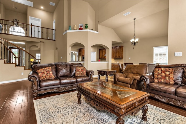 1518 E Oates Rd, Garland, TX 75043 - living area featuring hardwood / wood-style flooring, a chandelier, baseboards, plenty of natural light, and high vaulted ceiling