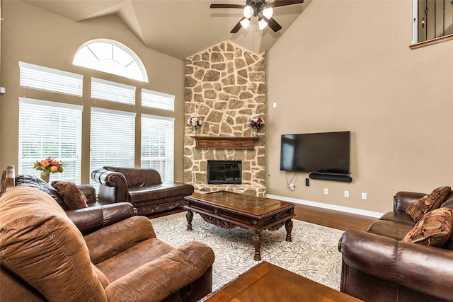 1518 E Oates Rd, Garland, TX 75043 - living area with a ceiling fan, high vaulted ceiling, wood finished floors, healthy amount of natural light, and a stone fireplace