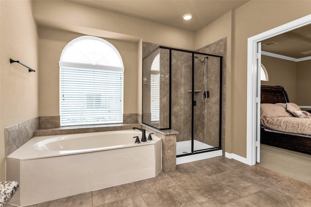 1518 E Oates Rd, Garland, TX 75043 - ensuite bathroom with a garden tub, a shower stall, and plenty of natural light