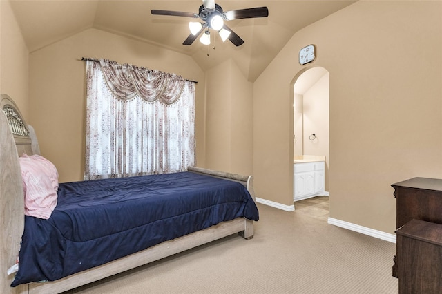 1518 E Oates Rd, Garland, TX 75043 - carpeted bedroom with lofted ceiling, connected bathroom, arched walkways, and ceiling fan