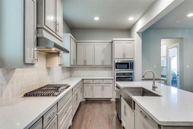 1031 Devonshire Dr, Allen, TX 75013 - kitchen featuring appliances with stainless steel finishes, a sink, decorative backsplash, an island with sink, and recessed lighting
