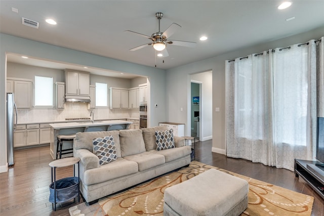 1031 Devonshire Dr, Allen, TX 75013 - living area with dark wood-style floors, a ceiling fan, recessed lighting, and baseboards