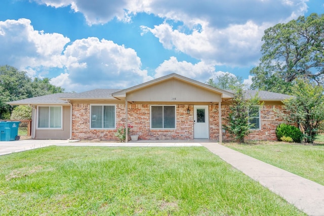 308 Larry Rd, Krugerville, TX 76227 - ranch-style house featuring a front lawn and brick siding