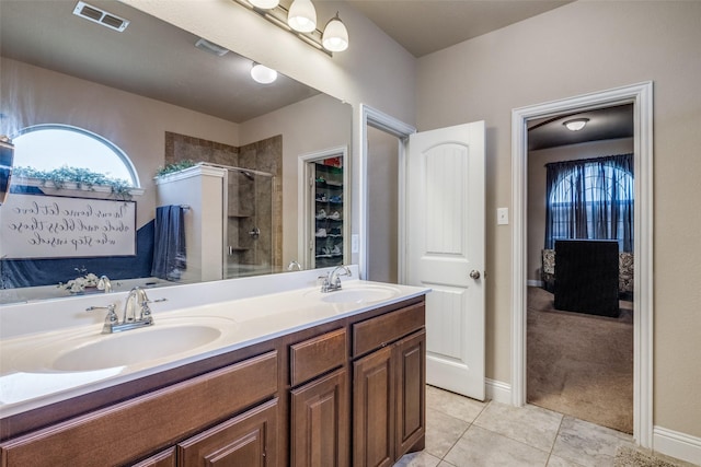 3717 Dutch Iris Ln, Forest Hill, TX 76140 - full bathroom featuring a shower stall, double vanity, tile patterned floors, and baseboards