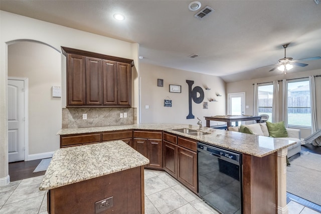 3717 Dutch Iris Ln, Forest Hill, TX 76140 - kitchen featuring dishwasher, a sink, a peninsula, decorative backsplash, and ceiling fan