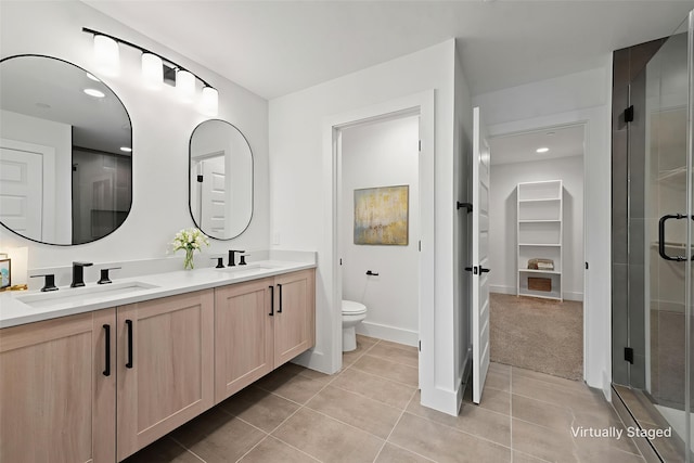 8901 Lowell St, Rowlett, TX 75089 - full bath featuring double vanity, tile patterned floors, a shower stall, toilet, and recessed lighting