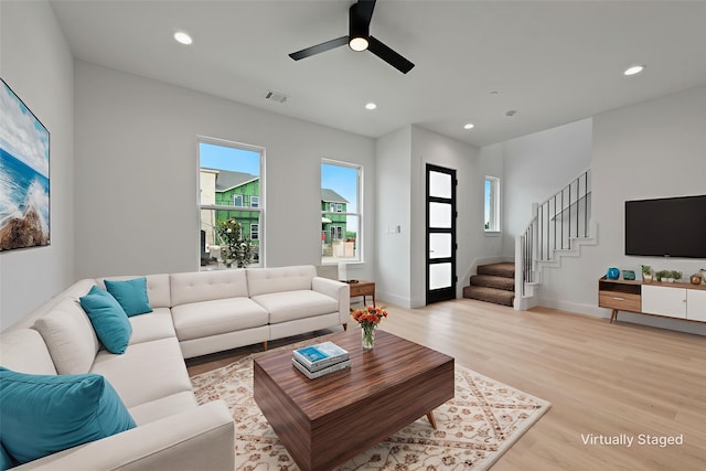 8901 Lowell St, Rowlett, TX 75089 - living room featuring light wood-style flooring, stairway, a ceiling fan, recessed lighting, and baseboards