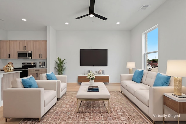 8901 Lowell St, Rowlett, TX 75089 - living room with a ceiling fan, light wood-style flooring, recessed lighting, and baseboards