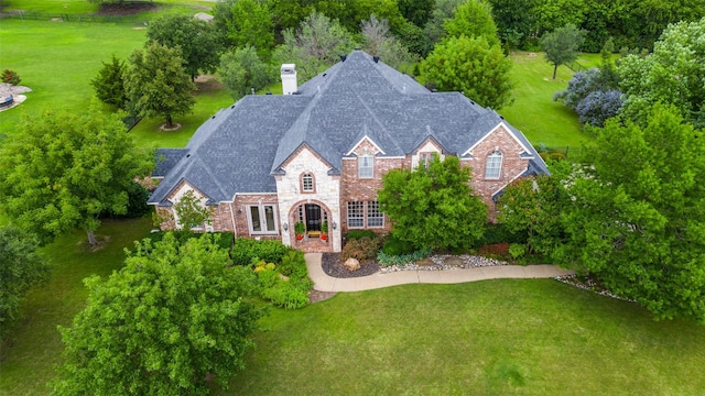 2841 Winding Creek Rd, Prosper, TX 75078 - view of front of property with stone siding, a chimney, and a front yard