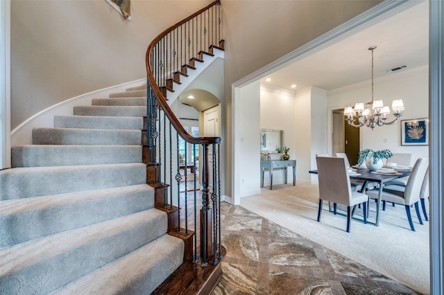 2841 Winding Creek Rd, Prosper, TX 75078 - staircase with ornamental molding, baseboards, a chandelier, carpet floors, and a towering ceiling